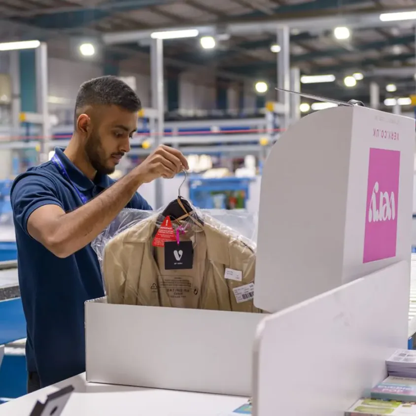 Employee packaging up clothes