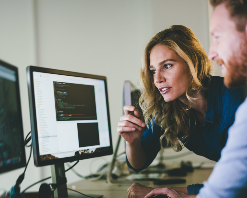 2 people working on a computer