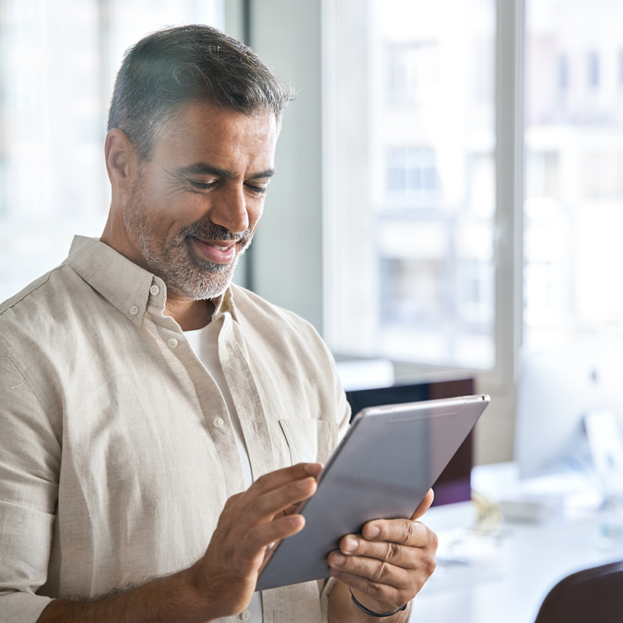 A person in an office using a tablet device